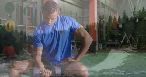 Man Exercising in Gym with Nature Overlay Inspiring Strength and Endurance