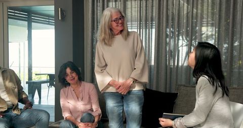 Group therapy session with diverse participants engaging actively