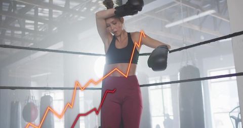 Female boxer leaning on ring ropes wearing gloves and leggings with rising graph overlay