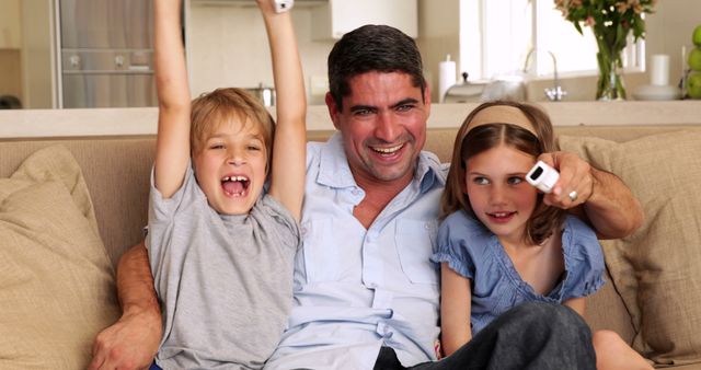 Father and Children Playing Video Games on Sofa - Download Free Stock Images Pikwizard.com