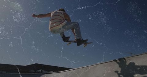 Dynamic Skateboarder Performing Trick at Urban Skate Park