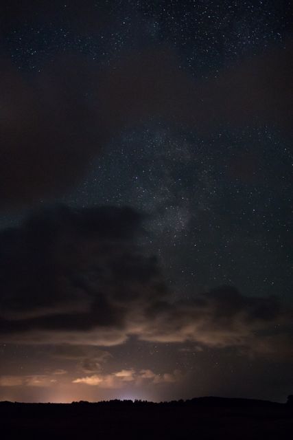 Night Sky with Cloudy Silhouette and Starry Galaxy - Download Free Stock Photos Pikwizard.com