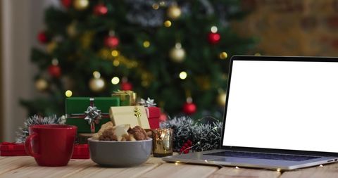 Festive Workspace with Blank Laptop Screen and Christmas Decor - Download Free Stock Images Pikwizard.com