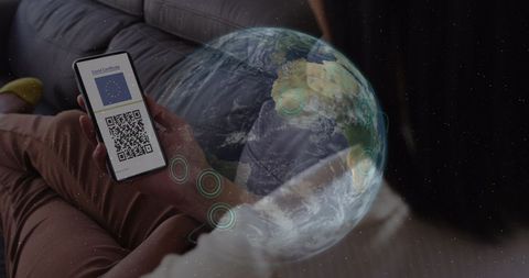 Woman Holding Smartphone with COVID-19 Passport Against Global Backdrop - Download Free Stock Images Pikwizard.com
