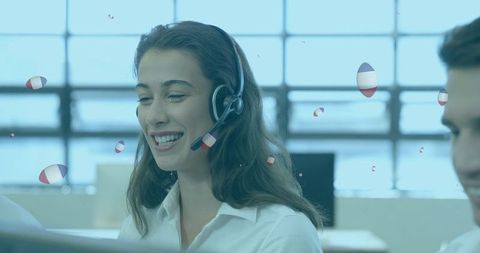 Smiling call center agents with french flag graphics