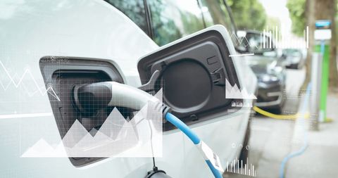 Electric car charging with data overlay on sustainable energy concept