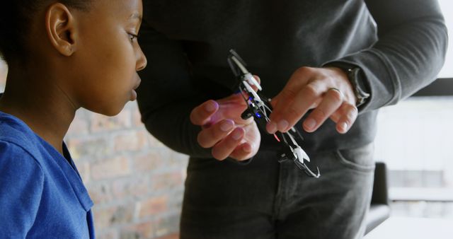 Child Learning to Build a Drone with Adult Assistance - Download Free Stock Images Pikwizard.com