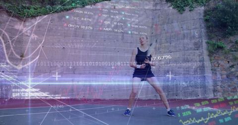 Athlete Analyzing Performance Stats Outdoors on Basketball Court