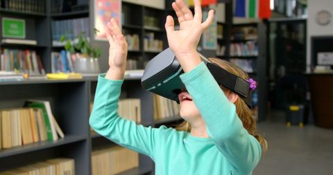 Schoolgirl Engaging with Virtual Reality in Library