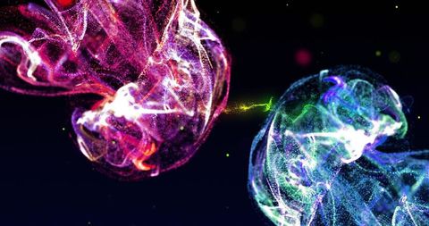Floating magenta and cyan particle clouds linking with green filament sparks in dark void