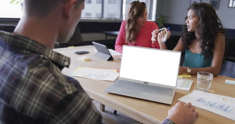 Team Collaboration in Modern Office with Laptops