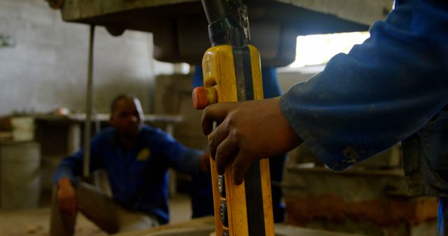 Factory Worker Operating Heavy Machinery in Industrial Workshop - Download Free Stock Images Pikwizard.com