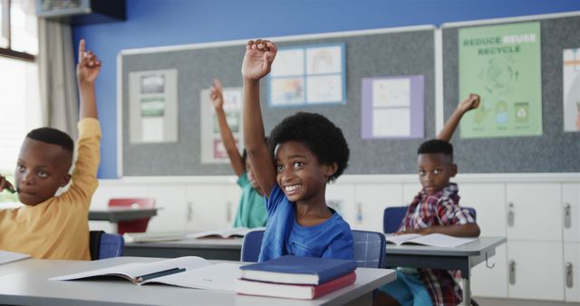 Engaged African American Elementary Students Raising Hands in Classroom - Download Free Stock Images Pikwizard.com