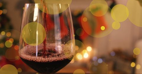 Festive Christmas Eve with Wine and Cheerful Lights - Download Free Stock Images Pikwizard.com