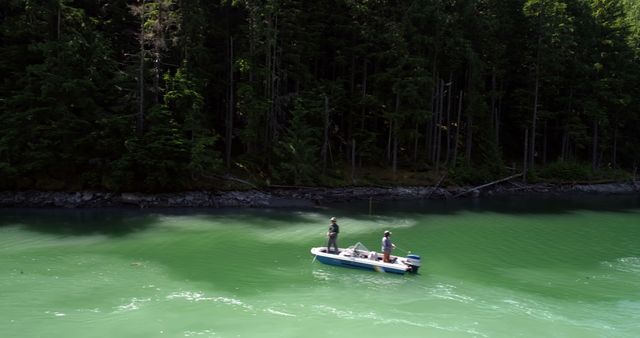 Fishing on Serene Lake Surrounded by Lush Forest - Download Free Stock Images Pikwizard.com
