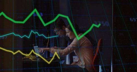 Business professionals analyzing data in high-tech control room