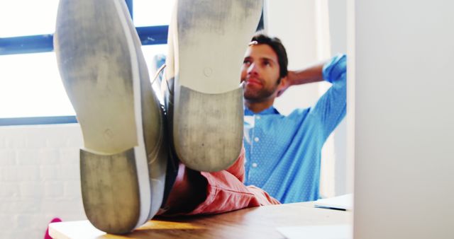 Relaxed Man with Feet on Office Desk in Casual Environment - Download Free Stock Images Pikwizard.com