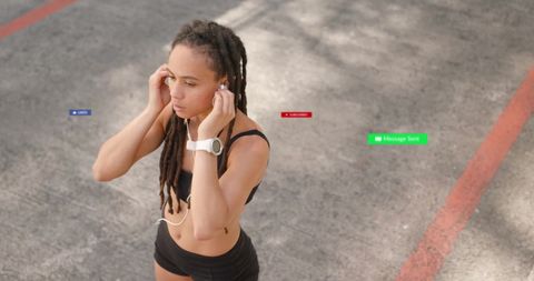 Woman training outdoors with social media notifications