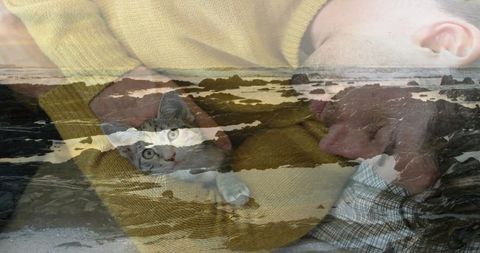 Man Relaxing with Cat Overlayed by Coastal Scenery