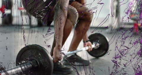 Weightlifter gripping loaded barbell preparing for heavy deadlift with gritty streaks