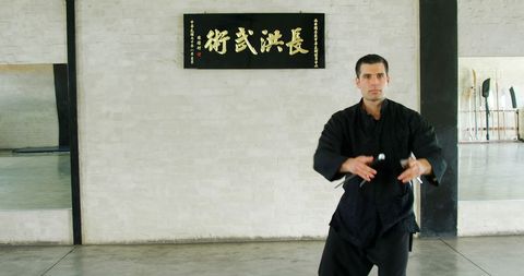 Martial Artist Training in Traditional Dojo Setting