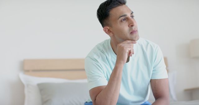 Young Man Thinking Contemplatively in Bright Room - Download Free Stock Images Pikwizard.com