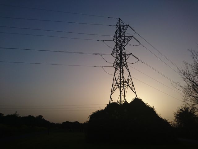 Silhouette of Electrical Tower and Power Lines at Twilight - Download Free Stock Photos Pikwizard.com