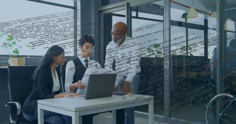 Diverse Business Team Using Laptop in Office Meeting