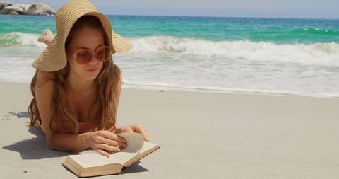 Woman Relaxing on Beach Reading Book in Sun Hat - Download Free Stock Images Pikwizard.com