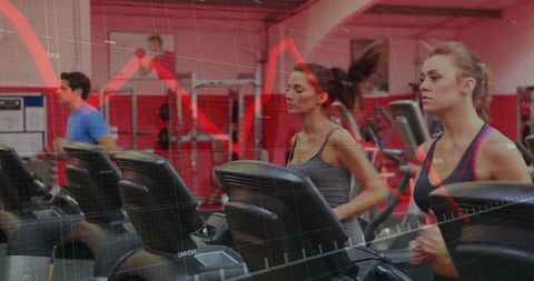 Athletic Adults Running on Treadmills with Digital Data Overlay