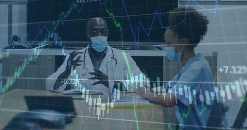 Healthcare professionals analyzing medical data in conference room