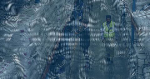 Warehouse Staff Conducting Inventory Inspection with Clipboard