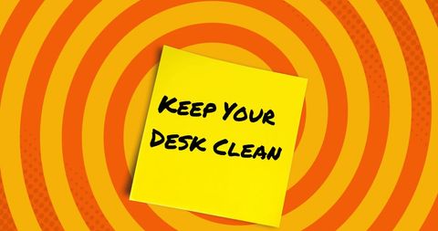 Motivational note to keep desk clean on vibrant background