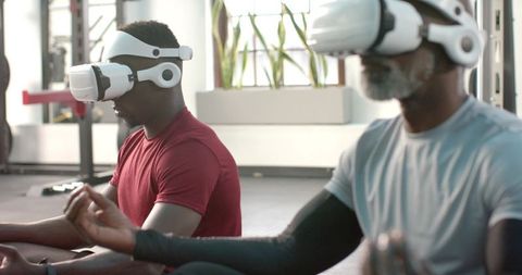 African American men meditating with VR headsets at gym practicing mindfulness