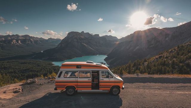 Orange Camper Van Overlooking Stunning Mountain Vista and Serene Lake