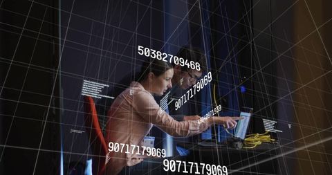 Innovative IT Professionals Analyzing Data in Modern Server Room