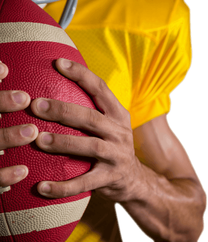 This image depicts a player holding a football closely, showcasing focus and athleticism. Ideal for sports advertising, equipment promotions, or motivating athletic materials.
