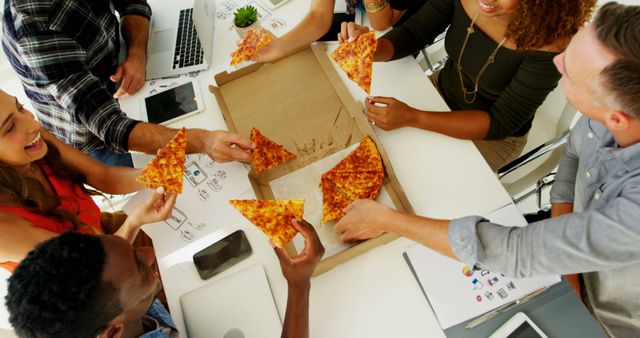 Diverse Group of Young Professionals Sharing Pizza During Office Lunch Break - Download Free Stock Images Pikwizard.com