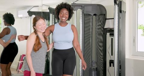 Fitness Success Celebration in Gym Environment with Diverse Women