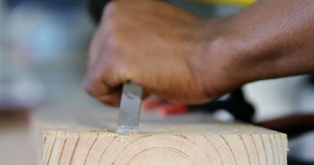 Carpenter's Hand Using Chisel On Wooden Plank In Workshop - Download Free Stock Images Pikwizard.com