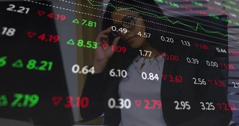 Focused Businesswoman Analyzing Stock Market Data on Laptop