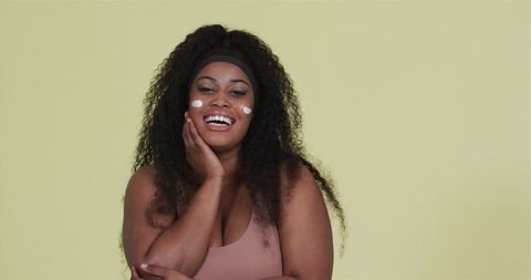 Confident African American Woman Embracing Skincare