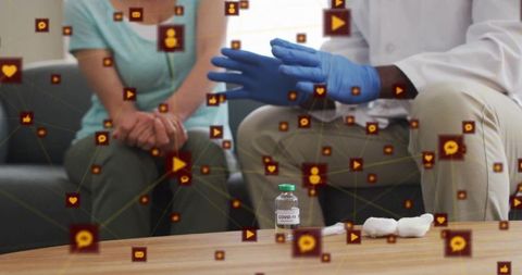 Doctor Explaining COVID-19 to Patient with Digital Overlay