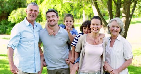 Extended Family Laughing Together in Sunny Garden - Download Free Stock Images Pikwizard.com