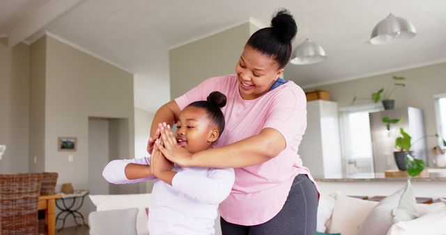 Mother Guiding Daughter in At-Home Yoga Practice - Download Free Stock Images Pikwizard.com