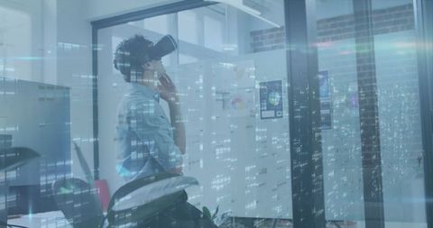 Businessman experiencing virtual reality and data interface