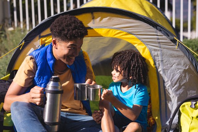 Perfect for family lifestyle blogs, advertisements related to outdoor activities, camping gear promotions, and articles on bonding and family fun. Captures the joy of spending quality time outdoors.
