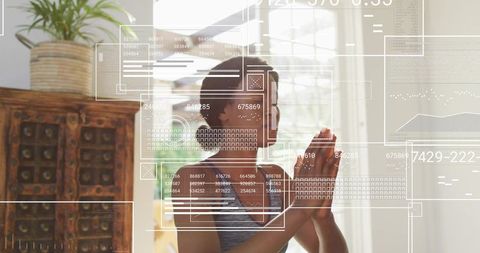 Woman praying with headphones by window with digital wellness UI overlays