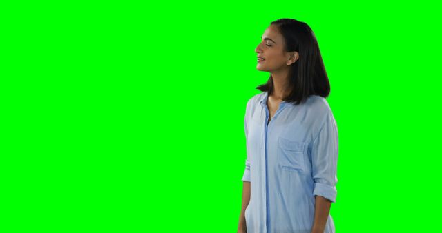 Content Woman in Light Blue Shirt on Green Screen - Download Free Stock Images Pikwizard.com