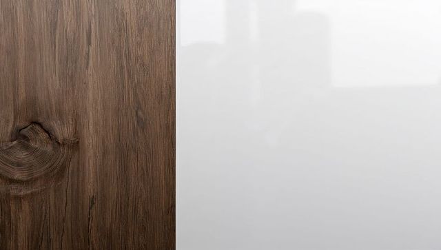 Dark walnut wood panel meeting glossy white lacquer cabinet seam with copy space